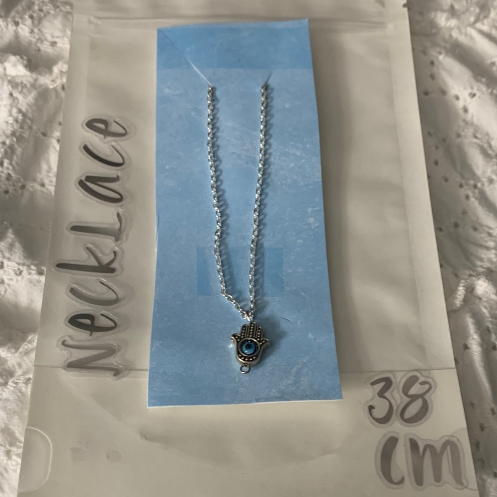 Silver Hamsa Necklace with Blue Accent